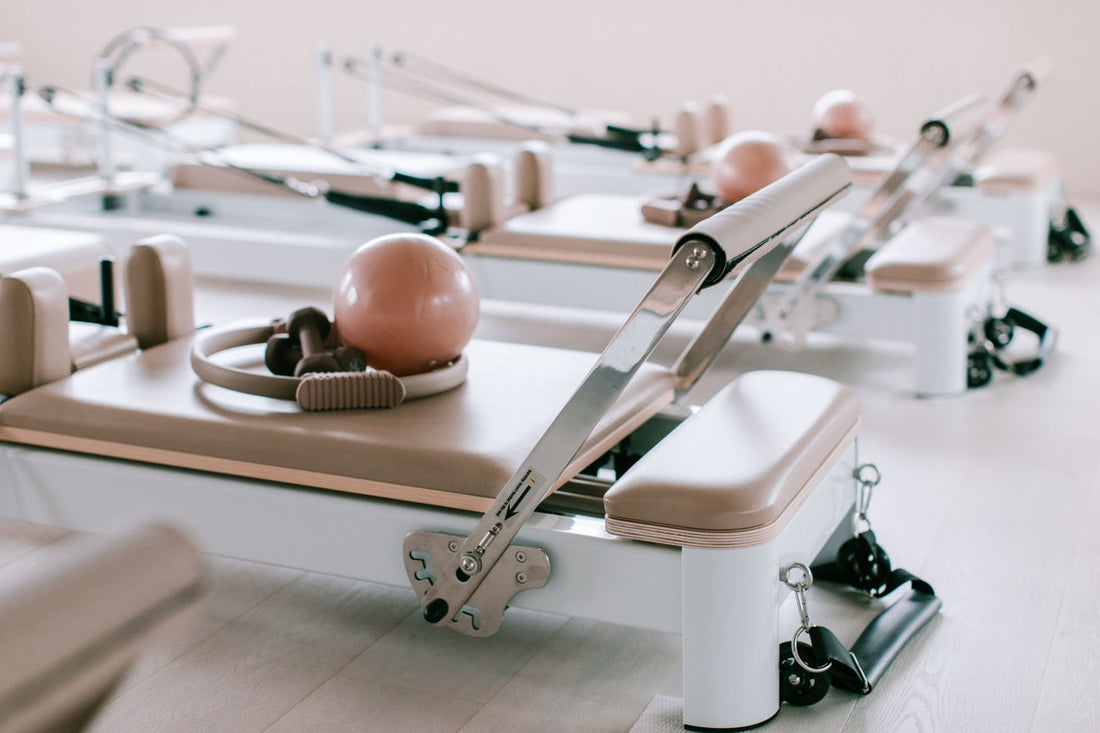 The Envy Reformers with Pilates accessories